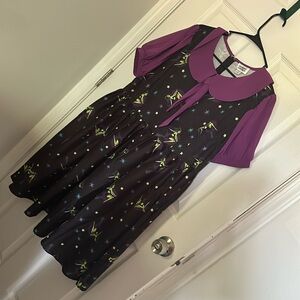 Witchy print dress with ribbon tie.